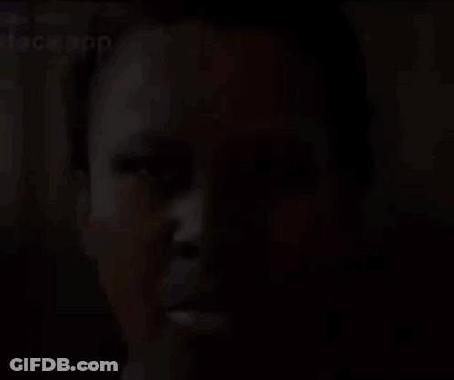 A Close Up Of A Person 'S Face With A Face App Written On It . GIF