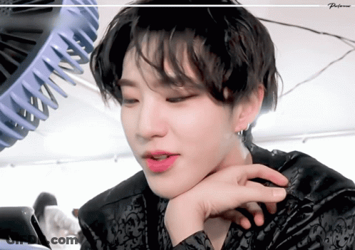 A Close Up Of A Person 'S Face With A Fan In The Background And The Word Preference On The Bottom GIF
