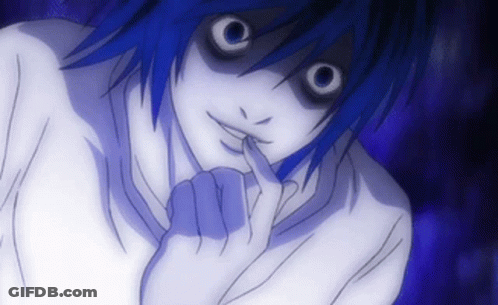 A Close Up Of A Person 'S Face With A Finger In Their Mouth GIF