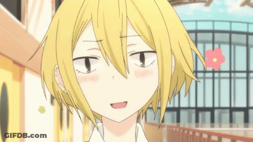 A Close Up Of A Person 'S Face With A Flower In The Background GIF