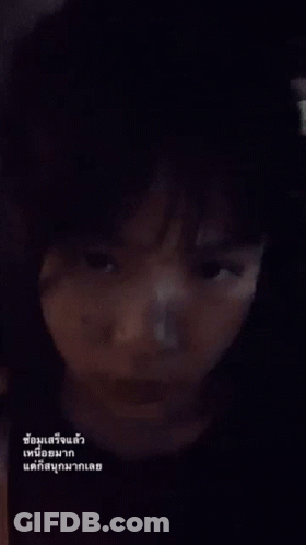 A Close Up Of A Person 'S Face With A Foreign Language Written On It GIF