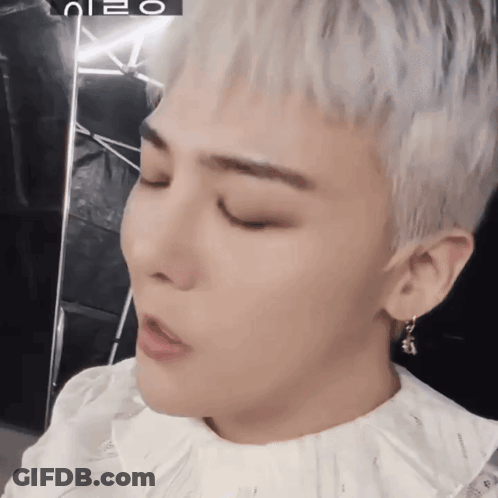 A Close Up Of A Person 'S Face With A Foreign Language Written On The Bottom GIF