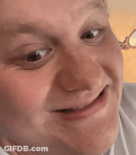 A Close Up Of A Person 'S Face With A Funny Face GIF