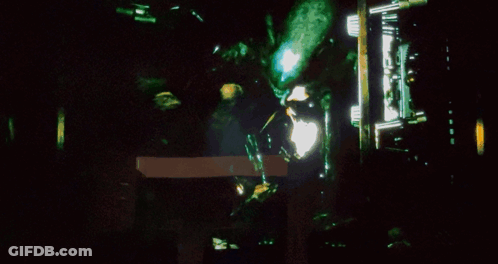 A Close Up Of A Person 'S Face With A Glowing Mouth GIF