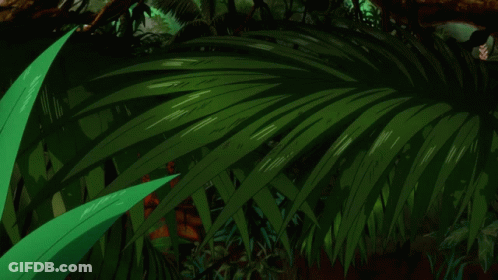 A Close Up Of A Person 'S Face With A Green Plant In The Background GIF