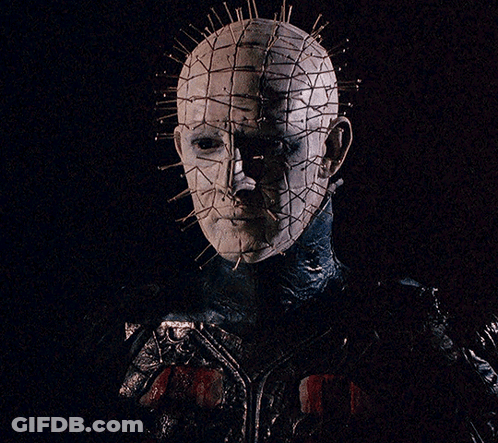 A Close Up Of A Person 'S Face With A Grid Of Pins On It GIF