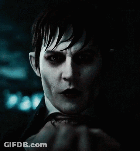 A Close Up Of A Person 'S Face With A Hand Covering It GIF