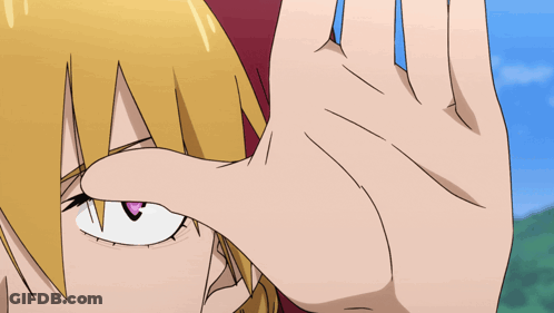 A Close Up Of A Person 'S Face With A Hand Covering It GIF