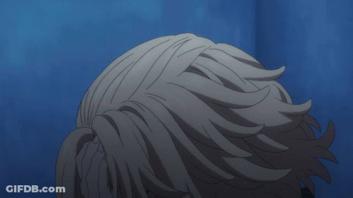A Close Up Of A Person 'S Face With A Hand On It GIF