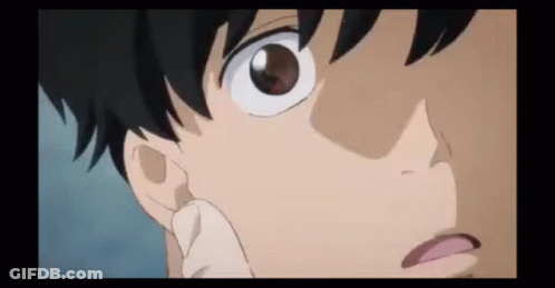 A Close Up Of A Person 'S Face With A Hand On Their Face . GIF