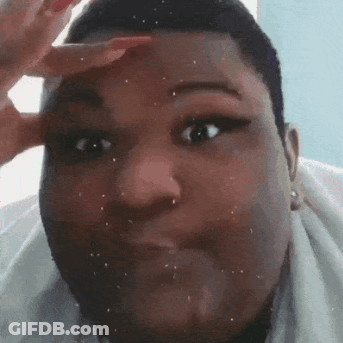 A Close Up Of A Person 'S Face With A Hand On Their Forehead Making A Funny Face . GIF