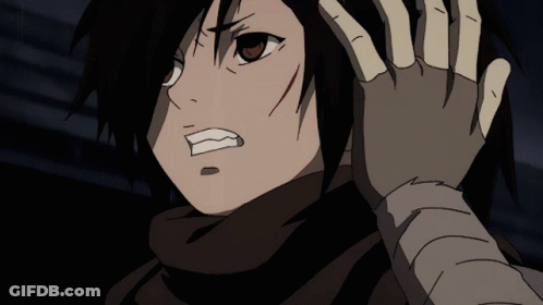 A Close Up Of A Person 'S Face With A Hand On Their Head GIF
