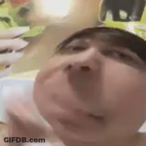 A Close Up Of A Person 'S Face With A Hat On Making A Funny Face . GIF