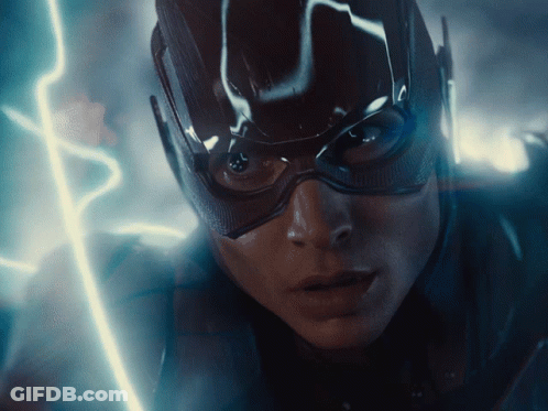 A Close Up Of A Person 'S Face With A Lightning Bolt Behind Them GIF