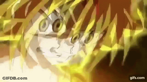 A Close Up Of A Person 'S Face With A Lot Of Yellow Glowing Lines Coming Out Of It . GIF
