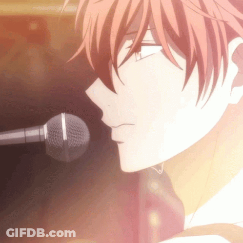 A Close Up Of A Person 'S Face With A Microphone GIF