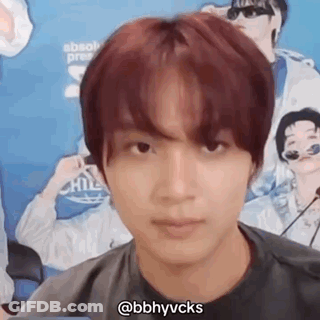 A Close Up Of A Person 'S Face With A Microphone In Front Of Him . GIF