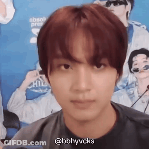 A Close Up Of A Person 'S Face With A Microphone In Front Of Them . GIF