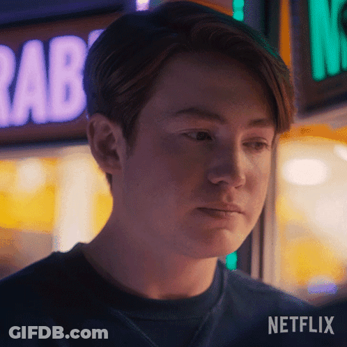 A Close Up Of A Person 'S Face With A Netflix Logo In The Bottom Right Corner GIF