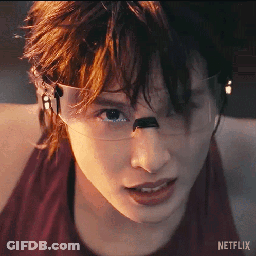 A Close Up Of A Person 'S Face With A Netflix Logo On The Bottom Right GIF