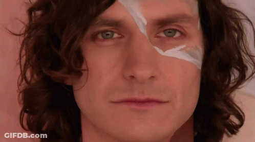 A Close Up Of A Person 'S Face With A Piece Of Tape On It GIF