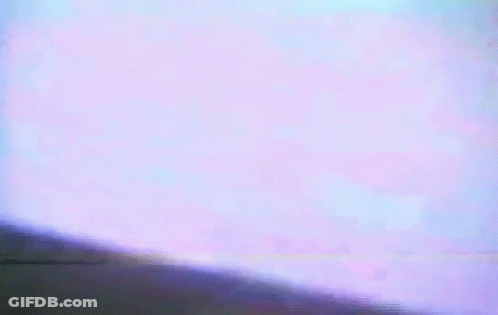 A Close Up Of A Person 'S Face With A Purple Background GIF