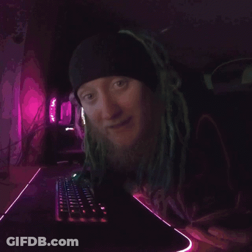 A Close Up Of A Person 'S Face With A Purple Background . GIF