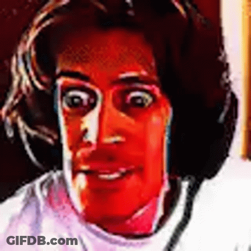 A Close Up Of A Person 'S Face With A Red Background And Headphones On . GIF
