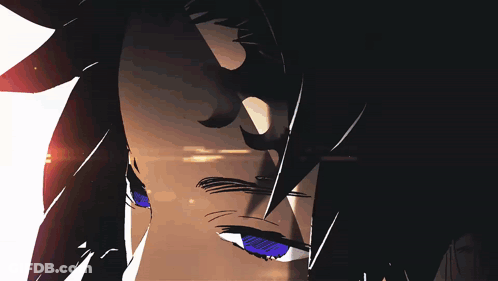 A Close Up Of A Person 'S Face With A Red Light Behind It GIF