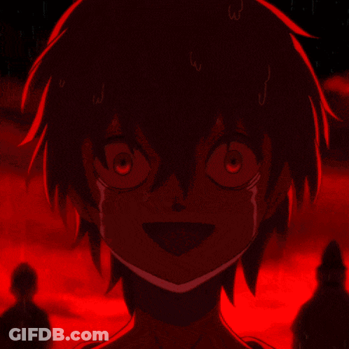 A Close Up Of A Person 'S Face With A Red Light Behind Them GIF
