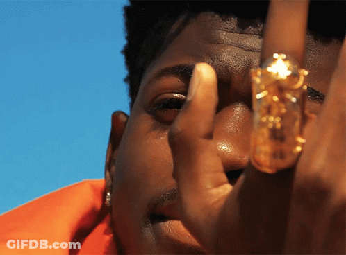 A Close Up Of A Person 'S Face With A Ring On It GIF