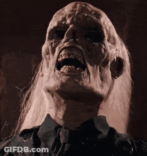 A Close Up Of A Person 'S Face With A Screaming Expression GIF