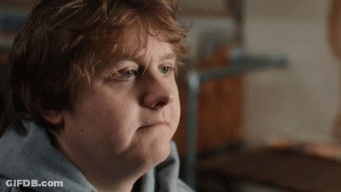 A Close Up Of A Person 'S Face With A Serious Look On Their Face GIF