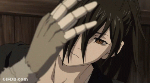 A Close Up Of A Person 'S Face With A Skeleton Hand GIF