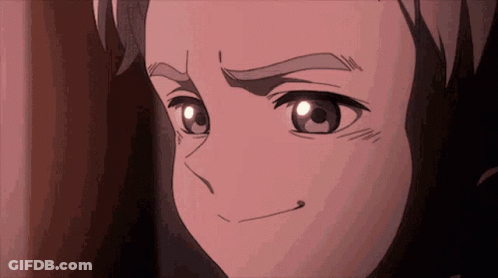 A Close Up Of A Person 'S Face With A Slight Smile On Their Face GIF