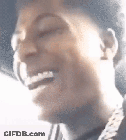 A Close Up Of A Person 'S Face With A Smile On It . GIF