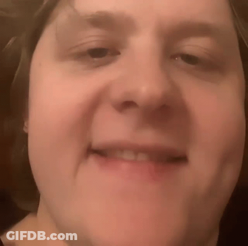 A Close Up Of A Person 'S Face With A Smile On It GIF