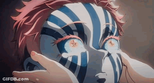 A Close Up Of A Person 'S Face With A Striped Face And Glowing Eyes . GIF