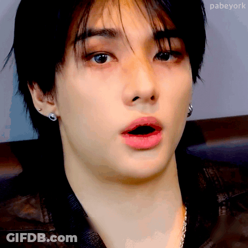 A Close Up Of A Person 'S Face With A Surprised Look On His Face . GIF