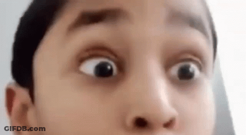 A Close Up Of A Person 'S Face With A Surprised Look On It . GIF