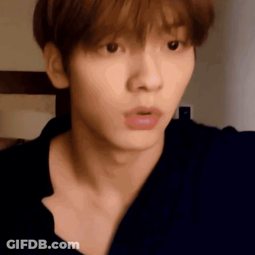 A Close Up Of A Person 'S Face With A Surprised Look On Their Face GIF