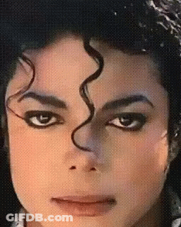A Close Up Of A Person 'S Face With A Swirl In The Hair GIF