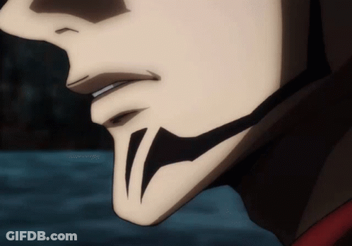 A Close Up Of A Person 'S Face With A Tattoo On It . GIF