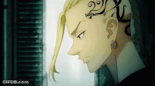 A Close Up Of A Person 'S Face With A Tattoo On The Back Of His Head GIF