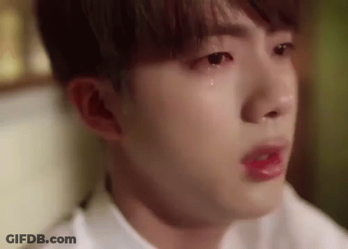A Close Up Of A Person 'S Face With A Tear Coming Out Of His Eye . GIF