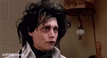 A Close Up Of A Person 'S Face With A Tear In His Eye . GIF