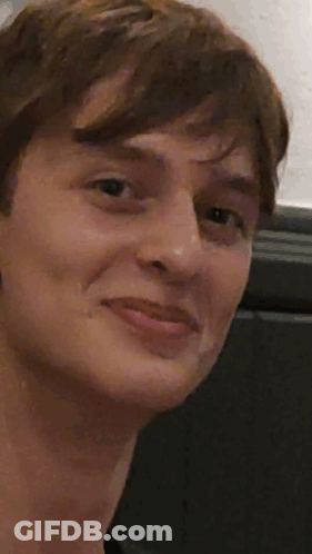 A Close Up Of A Person 'S Face With A Thumbs Up GIF