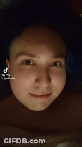 A Close Up Of A Person 'S Face With A Tiktok Sticker On It GIF
