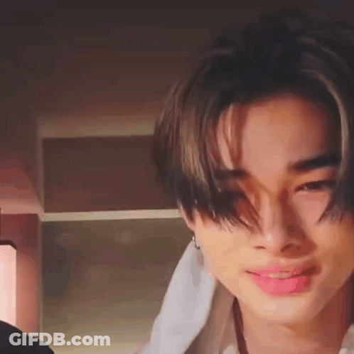 A Close Up Of A Person 'S Face With A Towel Wrapped Around Their Neck . GIF