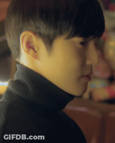 A Close Up Of A Person 'S Face With A Turtleneck GIF